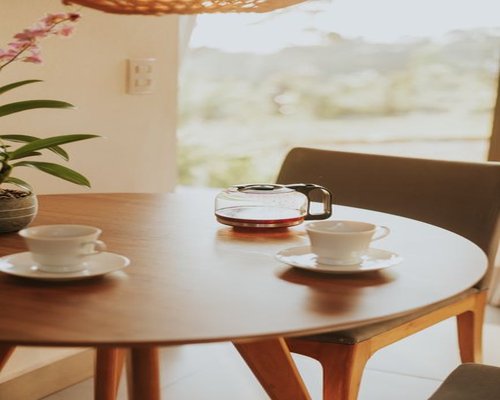 A calm breakfast table with coffee and sunlight at home in Mexico